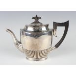 A late Victorian silver oval half-reeded teapot, Birmingham 1893 by George Ernest Hawkins, weight