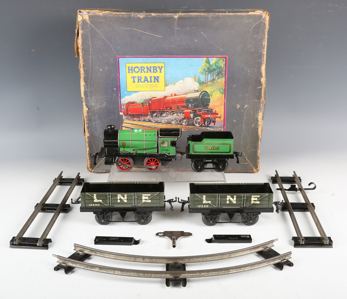 A Hornby gauge O clockwork M1 goods train set, boxed, together with a quantity of track and a