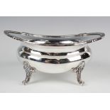 A Continental .925 silver oval lobed bowl with scallop shell and gadrooned rim, raised on cast