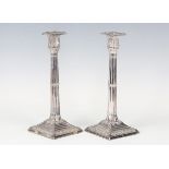 A pair of Victorian plated cluster column candlesticks, each with a detachable square nozzle and a