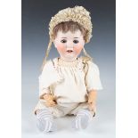 A W. Goebel bisque head doll, impressed 'GW' below a crown, with later brown wig, sleeping eyes,