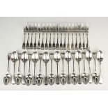 A Victorian part canteen of silver Fiddle pattern cutlery, comprising eighteen tablespoons and