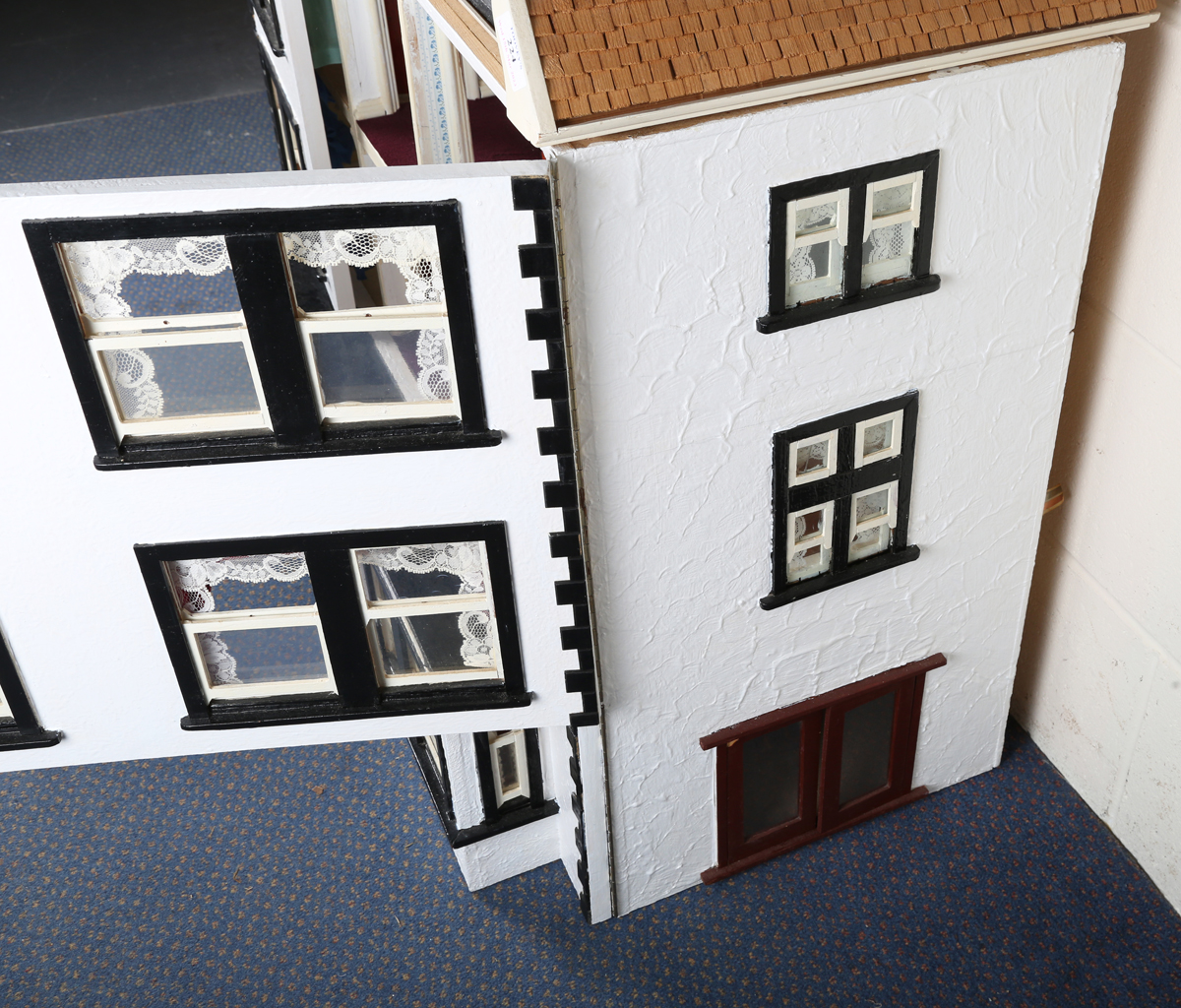 A 20th century Tudor style doll's house, the double-gabled tiled roof above a double opening front - Image 11 of 21