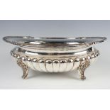 A Continental .925 silver oval lobed half-reeded bowl with scallop shell and gadrooned rim, raised