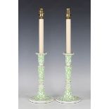 A pair of 20th century Colefax & Fowler ceramic table lamps, decorated with overall green seaweed,