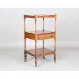 An early Victorian rosewood three-tier whatnot, fitted with a single drawer and raised on brass