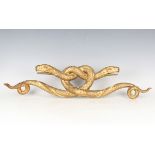 A 19th century carved giltwood moulding, finely modelled as two entwined serpents, width 77cm (