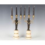 A pair of 20th century French Second Empire style brown patinated and gilt bronze three-light