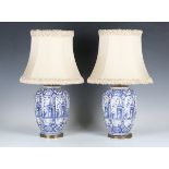 A pair of 20th century Dutch Delft blue and white table lamp bases, the shaped ovoid bodies