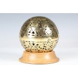 An 18th/19th century pierced and engraved brass spherical censer, the interior fitted with a