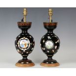 A pair of late 19th century French black glass table lamps, the baluster bodies enamelled with