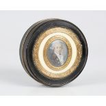 A George III tortoiseshell and gilt metal mounted circular snuff box and cover, the ivory mounted