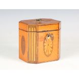 A George III satinwood and tulipwood crossbanded tea caddy with inlaid fan paterae, oval reserves