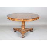 A William IV rosewood circular tip-top breakfast table, the tulip cusp stem on a triform base with