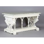 A 20th century Continental Renaissance style white painted carved wooden centre table, the green