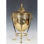 An early 20th century Neoclassical Revival brass coal bin, the lid with urn finial, the ovoid body