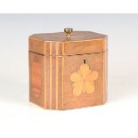A George III walnut tea caddy with inlaid fan, oval reserves and star, within boxwood fluting and