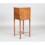 A George III mahogany pot cupboard, raised on block legs, height 80cm, width 32cm, depth 32cm.