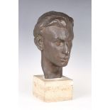 A mid-20th century brown patinated cast bronze bust of a young man, bearing cast 'M' and dated '