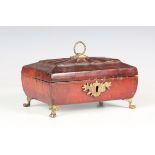A late George III red Morocco leather jewellery casket of sarcophagus form with foliate tooling