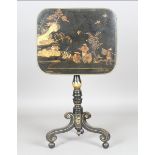 A Regency black and gilt chinoiserie tip-top wine table, the brass mounted top on a turned stem