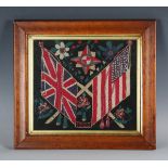 An Edwardian woolwork panel, worked with crossed Union Flag and the flag of the United States of