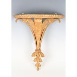A late 19th/early 20th century giltwood wall bracket, the demi-lune top raised on five finely carved