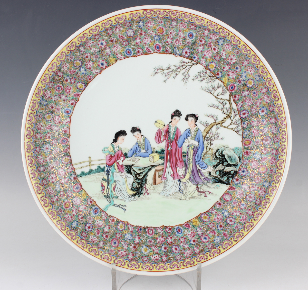 A Chinese famille rose porcelain circular charger dish, mark of Qianlong but 20th century, painted