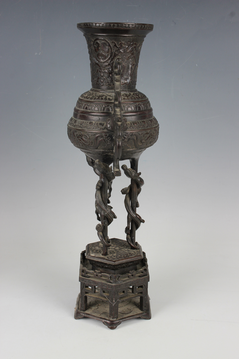 A pair of Japanese brown patinated bronze two-handled vases and integral stands, Meiji period, - Image 4 of 17