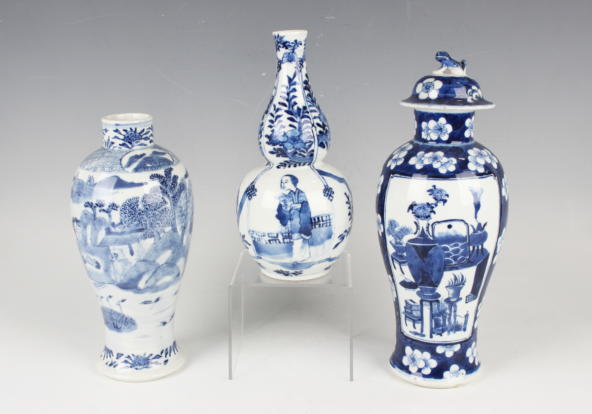 A Chinese blue and white porcelain double gourd shaped vase, mark of Kangxi but late 19th century,