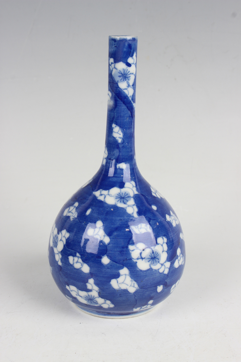 A Chinese blue and white porcelain 'phoenix tail' vase, late 19th century, painted with blossoming - Image 3 of 29