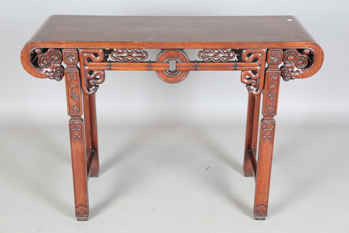 A Chinese hardwood altar table, 20th century, the rectangular panelled top with curved ends, the - Image 11 of 28