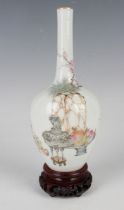 A Chinese Qianjiangcai enamelled porcelain bottle vase, probably Republic period, the ovoid body and