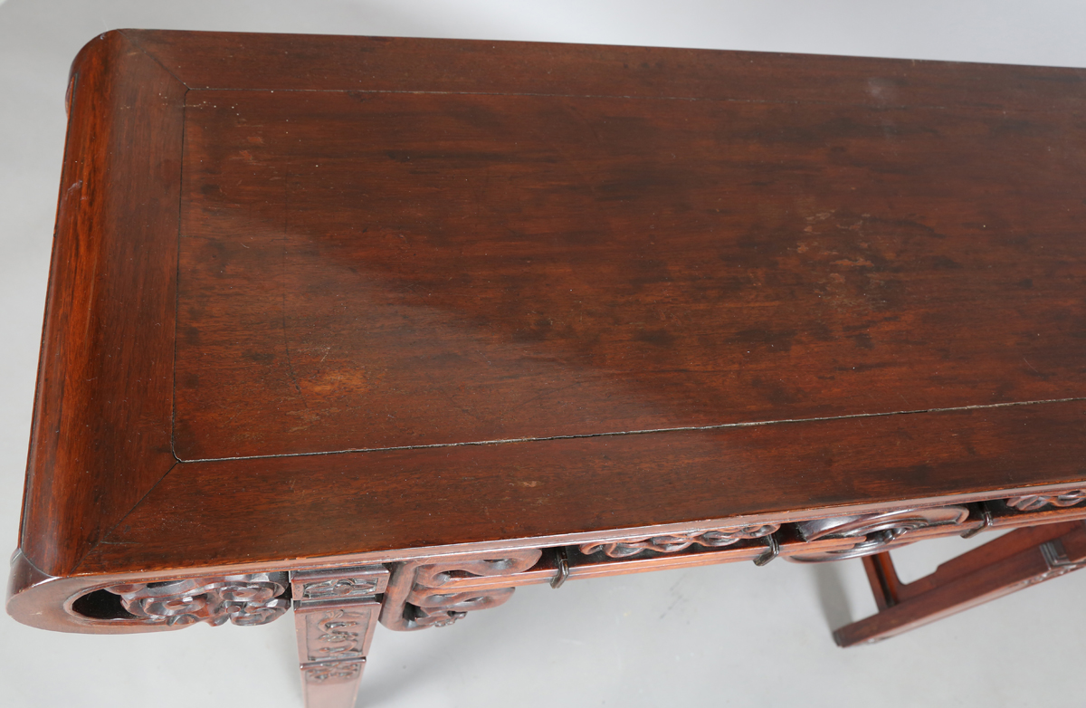 A Chinese hardwood altar table, 20th century, the rectangular panelled top with curved ends, the - Image 28 of 28