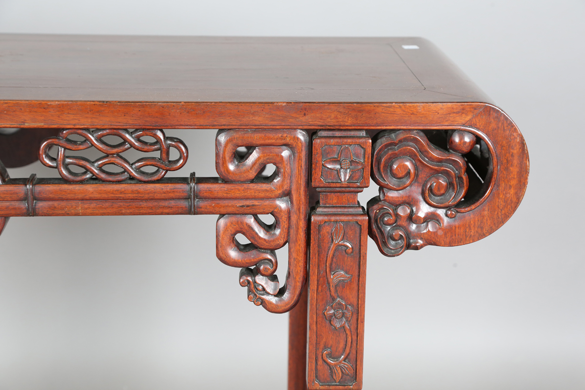 A Chinese hardwood altar table, 20th century, the rectangular panelled top with curved ends, the - Image 10 of 28