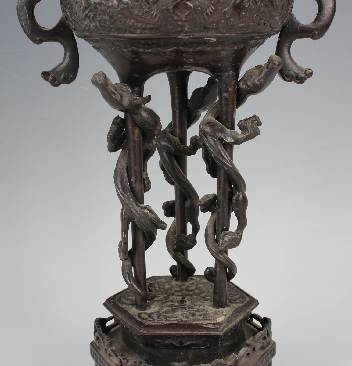 A pair of Japanese brown patinated bronze two-handled vases and integral stands, Meiji period, - Image 8 of 17