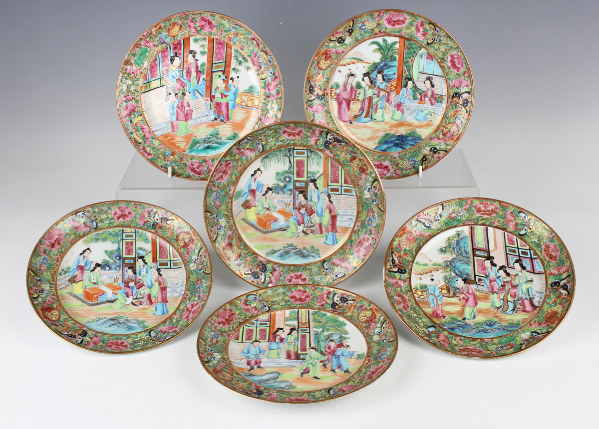 A set of six Chinese Canton famille rose porcelain plates, mid-19th century, each painted with a