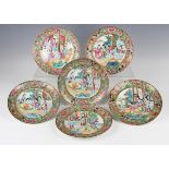 A set of six Chinese Canton famille rose porcelain plates, mid-19th century, each painted with a