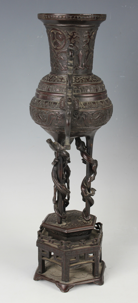 A pair of Japanese brown patinated bronze two-handled vases and integral stands, Meiji period, - Image 11 of 17