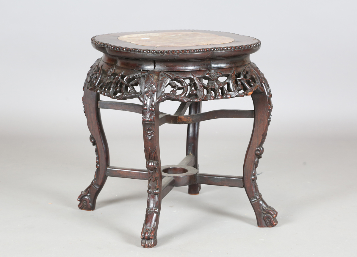 A Chinese hardwood jardinière stand, early 20th century, the lobed top with inset rouge marble panel