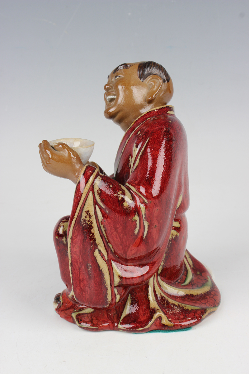 A Chinese Shiwan pottery sang-de-boeuf glazed figure of Guan Yu, modelled in a seated pose, - Image 6 of 22