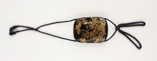 A Japanese lacquer three-case inro, Meiji period, of flattened oblong form, each side finely