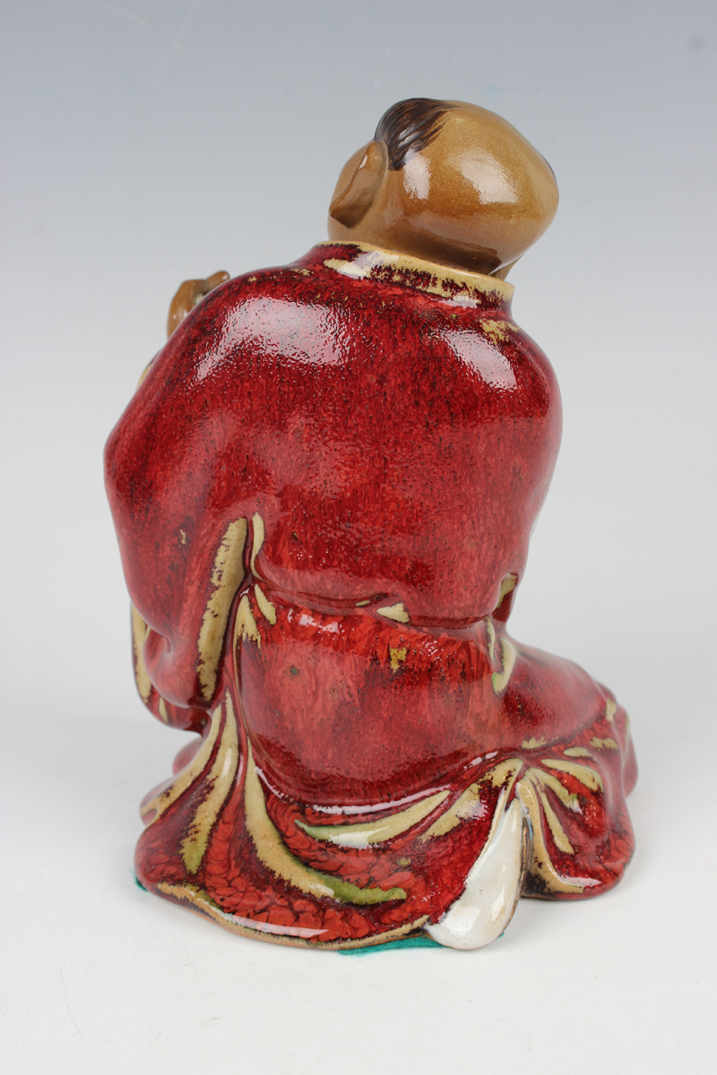 A Chinese Shiwan pottery sang-de-boeuf glazed figure of Guan Yu, modelled in a seated pose, - Image 5 of 22