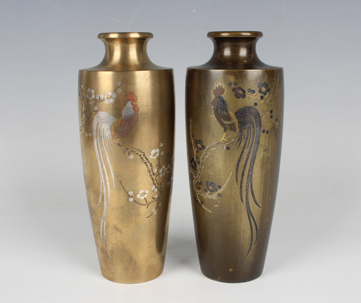 A pair of Japanese mixed metal inlaid bronze vases, Meiji period, each shouldered tapering body