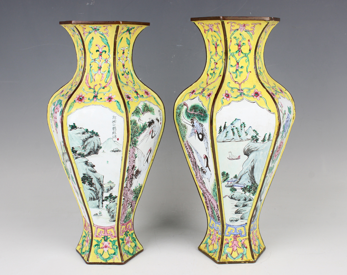 A pair of Chinese Canton enamel vases, 20th century, each of hexagonal baluster form, each facet
