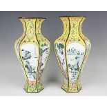 A pair of Chinese Canton enamel vases, 20th century, each of hexagonal baluster form, each facet