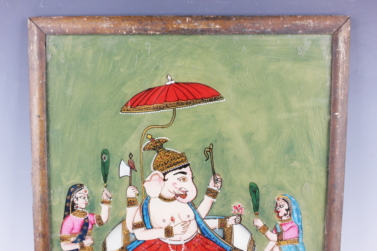 An Indian reverse painting on glass, late 19th/early 20th century, depicting Ganesh seated on a - Image 5 of 5