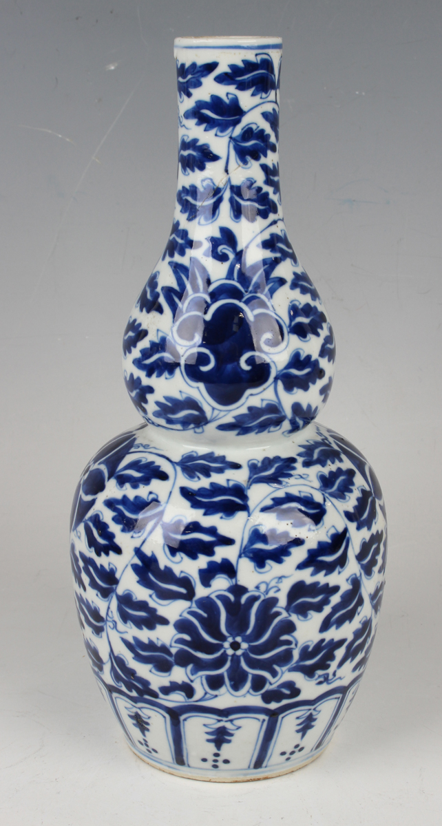 A small group of Chinese blue and white porcelain, late 19th century, comprising a prunus- - Image 16 of 26
