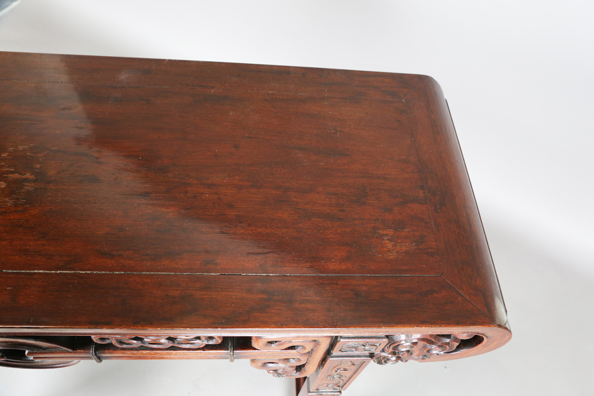 A Chinese hardwood altar table, 20th century, the rectangular panelled top with curved ends, the - Image 27 of 28
