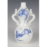 A Japanese Hirado blue and white porcelain vase, Meiji period, the double gourd shaped body